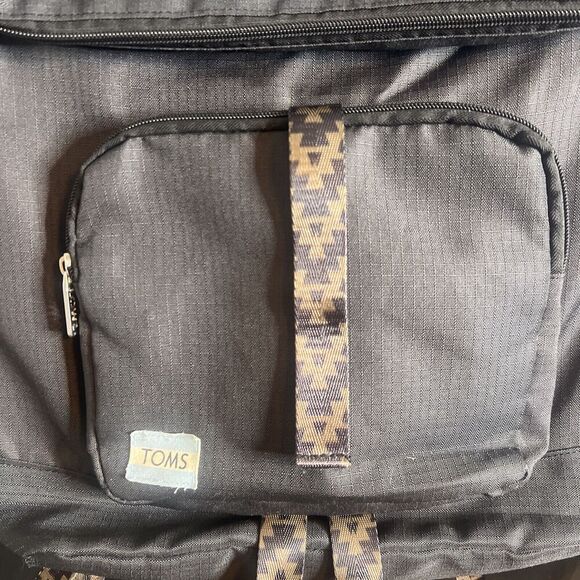 Toms StandUp Backpack Solid Black W/ Aztec detail Zipper Closure Fold-over Flaws - Picture 2 of 9